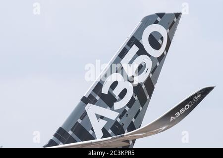Singapore - February 17, 2016: Tailplane and winglet of an Airbus A350 XWB in Airbus factory livery during Singapore Airshow at Changi Exhibition Cent Stock Photo