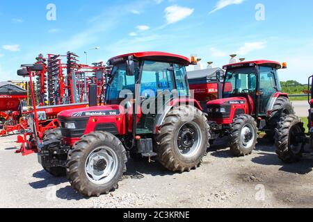 Kyiv, Ukraine - June 16, 2020: Mahindra agricultural heavy machinery equipment parked on the street at Kyiv, Ukraine on June 16, 2020 Stock Photo