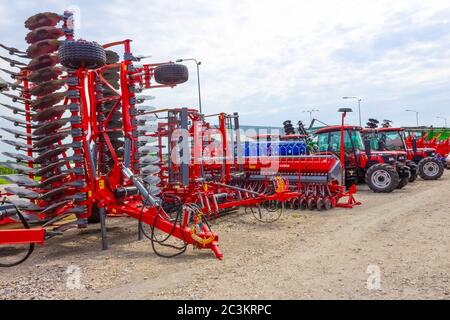 Kyiv, Ukraine - June 16, 2020: Tractor and Unia cultivator on the land for minimum-tillage technology at Kyiv, Ukraine on June 16, 2020. Stock Photo