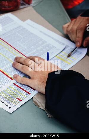 Hands of a man while working on the important documents Stock Photo