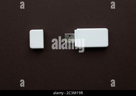 Flash drive. Compact usb drive. Close up of a flash memory template on brown background Stock Photo