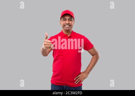 Delivery Man Showing Thumb Up. Indian Delivery Boy Smiling. Home Delivery. Stock Photo