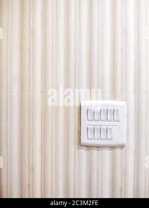 White Light switch on switchboard - Light brown background Stock Photo