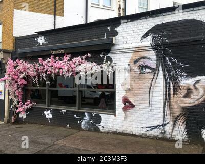Graffiti on a closed restaurant during the pandemic at Clapham North Stock Photo