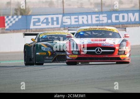 DUBAI - JANUARY 14: Race winner, a Mercedes SLS AMG GT3 in front of last year's winner, a BMW Z4 GT3, during the morning hours of the 2012 Dunlop 24 H Stock Photo