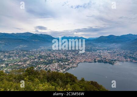 Stunning aerial panorama view of Lugano Lake, cityscape of Lugano, and Swiss Alps mountain on a cloudy summer day from top of Monte San Salvatore, Can Stock Photo