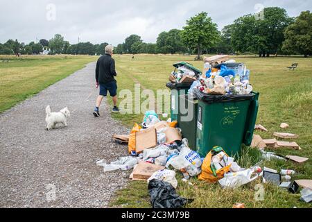 WIMBLEDON LONDON, UK. 21 June 2020. Rubbish bins are overflowing on  Wimbledon Common,after the government eased lockdown restrictions and allowed people to congregate in groups of up to six outdoors. Credit: amer ghazzal/Alamy Live News
