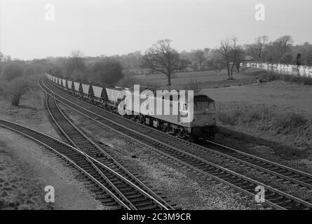 Class 47 diesel locomotive No. 47330 pulling a MGR coal train at Hatton, Warwickshire, England, UK. 14th April 1987. Stock Photo