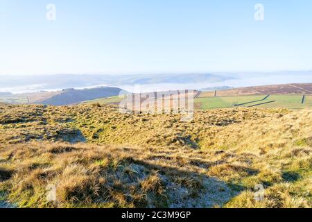 A foggy winter landscape in the Derbyshire Peak District seen from high up near Stanage Edge Stock Photo