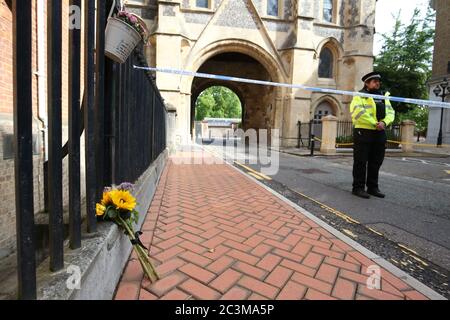 Police at the Abbey gateway of Forbury Gardens in Reading town centre following a multiple stabbing attack in the gardens which took place at around 7pm on Saturday leaving three people dead and another three seriously injured. Stock Photo