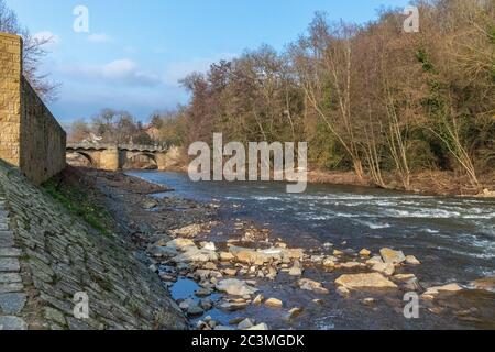 The river glan and stone bridge in Meisenheim, Germany Stock Photo