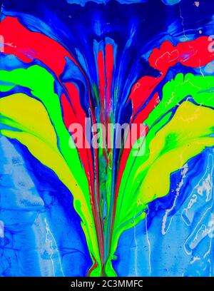 Psychedelic looking eruption of Green, Blue, Red, Yellow  acrylic paint  on an artists canvas Stock Photo