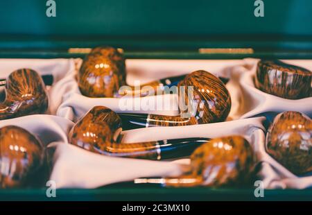 Wooden tobacco pipes in the case Stock Photo