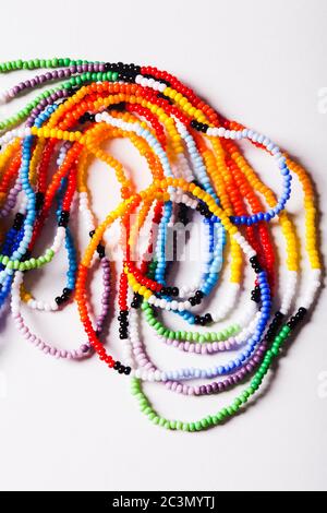 Small multicolor beads threaded into oriental chains Stock Photo