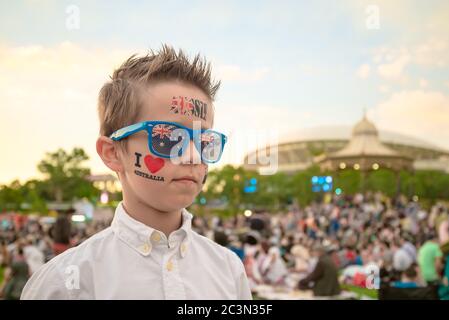 Australian kid celebrating Australia Day in Adelaide city while wearing  themed sunglasses Stock Photo