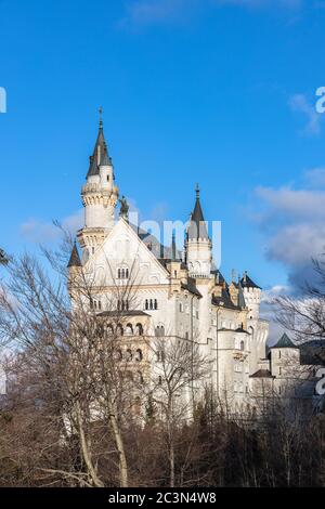 Close view of the famous Neuschwanstein Castle in the afternoon sunshine before sunset in winter, Schwangau, Bavaria, Germany Stock Photo