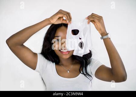Skin Moisturizing Smiling African Woman Applying Body Lotion In Bedroom At Home Stock Photo Alamy