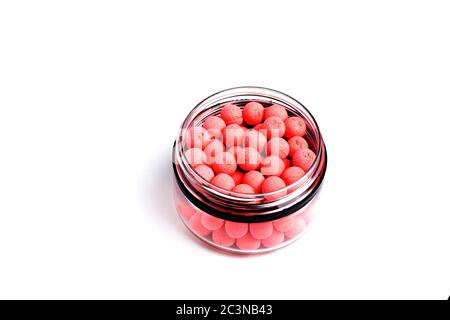 Close up view of orange boilies, fishing baits for carp isolated on white background. Stock Photo