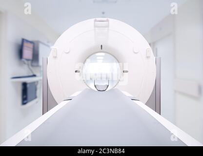 Front view of multi detector CT Scanner ( Computed Tomography ) isolated on blurred hospital room  background. Clipping path. Stock Photo