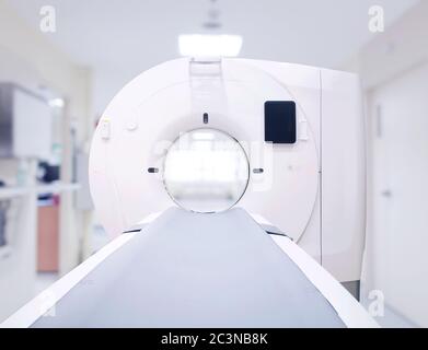 Front view of multi detector CT Scanner ( Computed Tomography ) isolated on blurred hospital room background. Clipping path. Stock Photo
