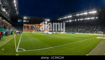 BUDAPEST, HUNGARY - JUNE 20: (EDITORS NOTE: Image is a digital [panoramic] composite.) Ultras of Ferencvarosi TC (as known as Green Monsters) hold a banner during the Hungarian OTP Bank Liga match between Ferencvarosi TC and Ujpest FC at Groupama Arena on June 20, 2020 in Budapest, Hungary. From June 18, 2020 is not limited the attendance at football events in Hungary. Stock Photo