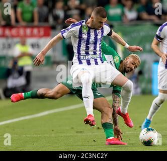 BUDAPEST, HUNGARY - JUNE 20: (r-l) Isael da Silva Barbosa of Ferencvarosi TC  challenges Dzenan Burekovic of Ujpest FC during the Hungarian OTP Bank Liga  match between Ferencvarosi TC and Ujpest FC