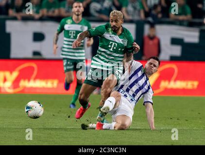 Lyes Houri of MOL Fehervar FC challenges David Siger of