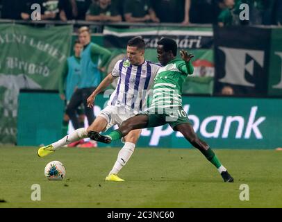 BUDAPEST, HUNGARY - JUNE 27: (l-r) Tokmac Chol Nguen of Ferencvarosi TC  fights for the ball with Dániel Farkas of Mezokovesd Zsory FC during the  Hungarian OTP Bank Liga match between Ferencvarosi TC and Mezokovesd Zsory  FC at Groupama