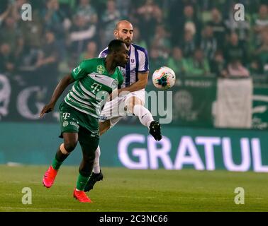 Ivan Petryak of MOL Fehervar FC dribbles between Franck Boli of