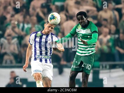 BUDAPEST, HUNGARY - JUNE 27: (l-r) Tokmac Chol Nguen of Ferencvarosi TC  fights for the ball with Dániel Farkas of Mezokovesd Zsory FC during the  Hungarian OTP Bank Liga match between Ferencvarosi TC and Mezokovesd Zsory  FC at Groupama