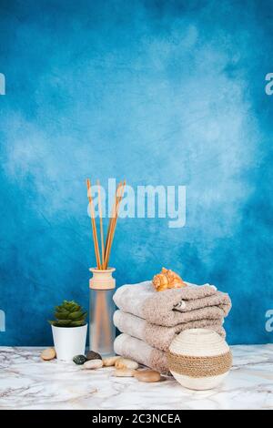 Spa objects and elements on a marble table and blue background Stock Photo