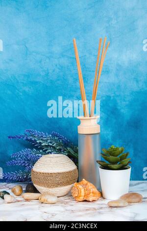 Spa objects and elements on a marble table and blue background Stock Photo