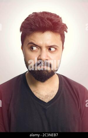 Young Men Looking Aside Wearing A Black T Shirt Isolated Stock Photo
