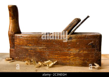 old wooden plane with chips on a white background Stock Photo