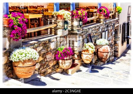 Traditional Greece. Typical street restaurants (taverns) of Greece. Naxos, Cycades. Stock Photo