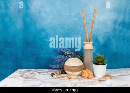 Spa objects and elements on a marble table and blue background Stock Photo