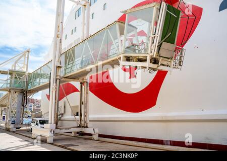 Mobile passenger gangway next to a cruise. Malaga, Spain - June 01, 2020. Stock Photo