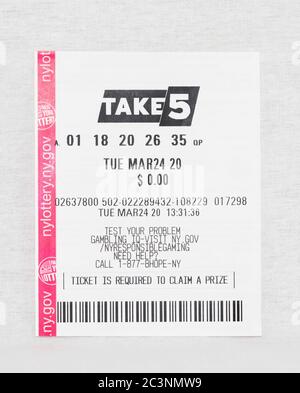 Babylon, New York, 11 April 2020: Losing take 5 lottery ticket from March 24 2020 with a white background. Stock Photo