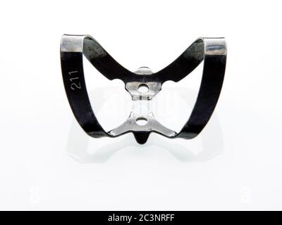 Dental Dam clamp on the white background Stock Photo