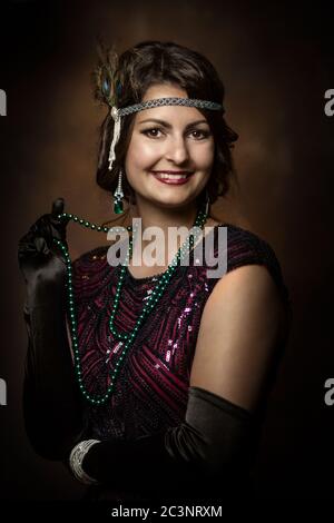 Young elegant lady in the golden twenties Stock Photo