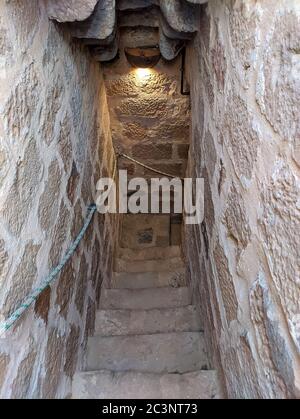 Old stone spiral staircase Stock Photo