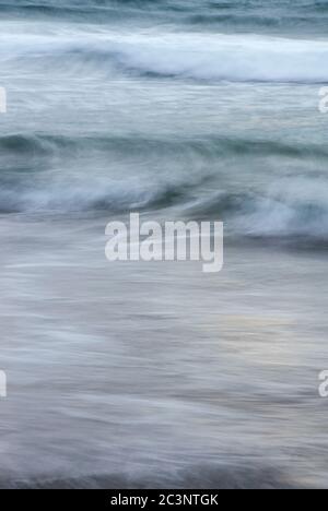Long exposure of waves on a beach Stock Photo