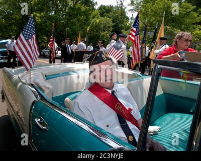 Oakland, NJ - May 24 - Memorial Day Parade. Grand Marshall Edmund Bush awaits the start of the parade in a vintage car. Stock Photo