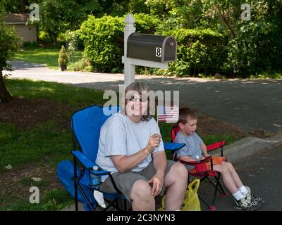 Oakland, NJ - May 24 - Memorial Day Parade. Oakland Volunteer Fire Department on the parade route. Terry Vollmin and son Andrew show their patriotic s Stock Photo