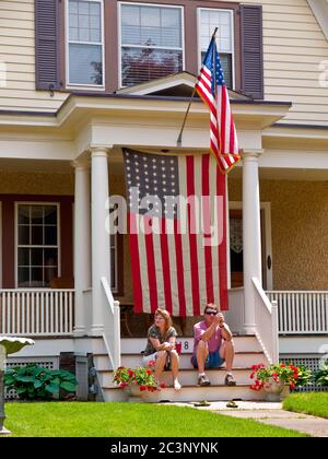 Oakland, NJ - May 24 - Memorial Day Parade. Ginny Chucka and Eddie Eilert outside their patrioticly decorated home that is on the parade route.  The l Stock Photo