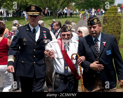 Oakland, NJ - May 24 - Memorial Day Parade.  The Grand Marshall is escorted by Bergen County Sheriff Leo McGuire and Maerican Legion Post 369 pas Comm Stock Photo