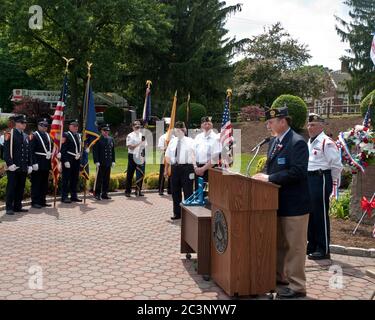 Oakland, NJ - May 24 - Memorial Day Parade.  American Legion Post past Commander Ron Beattie leads the ceremonies. Stock Photo