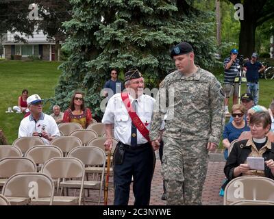 Oakland, NJ - May 24 - Memorial Day Parade.  Grand Marshall Edmund Bush is escorted to the podium by Sgt. Mike Alexander. Stock Photo