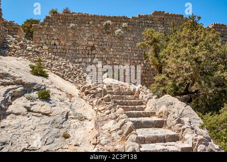 Stairs leading to the top of the rock with the Monolithos castle on the island of Rhodes. Greece Stock Photo