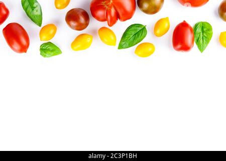 Isolated vegetables mix. Pieces of fresh tomato, cucumber, bell pepper isolated on white background with clipping path Stock Photo